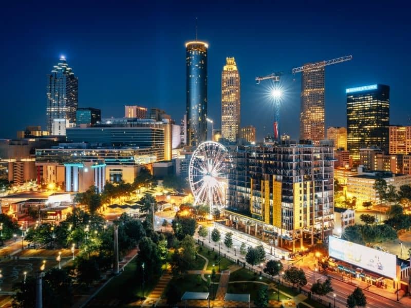 Nighttime city skyline with illuminated buildings, streets, and urban development for LaGrange land surveying services