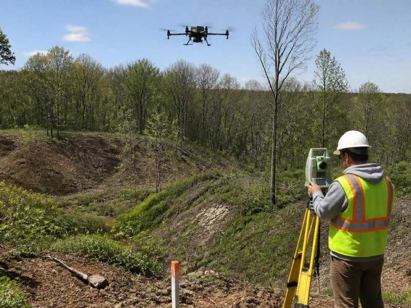 Drone-based LiDAR mapping over a wooded and uneven site in La Grange, GA, showing how aerial survey data improves terrain accuracy.
